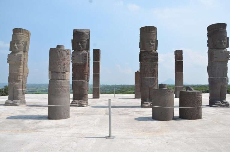 The basalt Atlantes of Tula standing atop Pyramid B with carved columns and the valley beyond